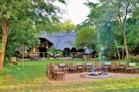 Ivory Lodge looking over fire pit to main building